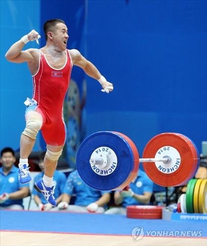 (LEAD) (Asiad) Weightlifter breaks world record to win first gold for N. Korea - 2