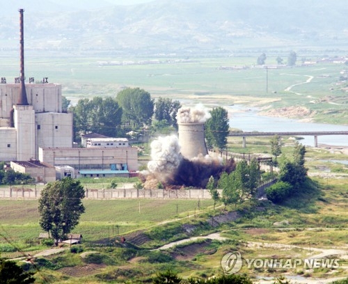 North Korea blows up a cooling tower at its Yongbyon nuclear complex in this 2008 file photo. (Yonhap)