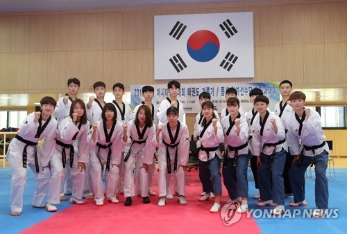 South Korean taekwondo practitioners for the Asian Games pose for a photo during a media event at the National Training Center in Jincheon, North Chungcheong Province, on Aug. 8, 2018. (Yonhap)