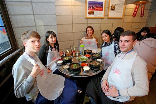 This image, provided by the Visit Korea Committee shows foreign tourists in a Korean restaurant during Korea Grand Sale 2019. (PHOTO NOT FOR SALE)