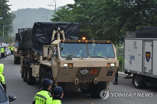 Military vehicles transport equipment to the site of the Terminal High Altitude Area Defense (THAAD) base in the town of Seongju, about 220 km south of Seoul, on May 29, 2020, as part of an upgrade, in this photo released by a group of residents and activists opposing the installation of the missile defense system. U.S. Forces Korea and South Korea's defense ministry, which had only used air transportation to move supplies due to strong opposition by local residents until now, are transporting equipment by ground to and from the system's site. (PHOTO NOT FOR SALE) (Yonhap)