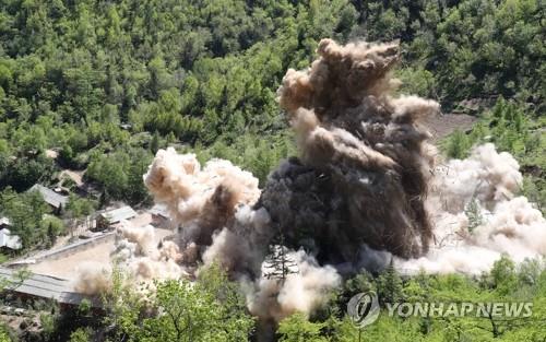 The file photo taken May 24, 2018, shows Tunnel No. 4 at North Korea's only known nuclear test site Punggye-ri being blown up, during the dismantlement of the site. The site was demolished in a series of explosions over several hours on the day, with press members from South Korea, China, Russia, the United States and Britain covering the process carried out in Kilju County of North Hamgyong Province in the country's northeast. (Pool photo) (Yonhap)