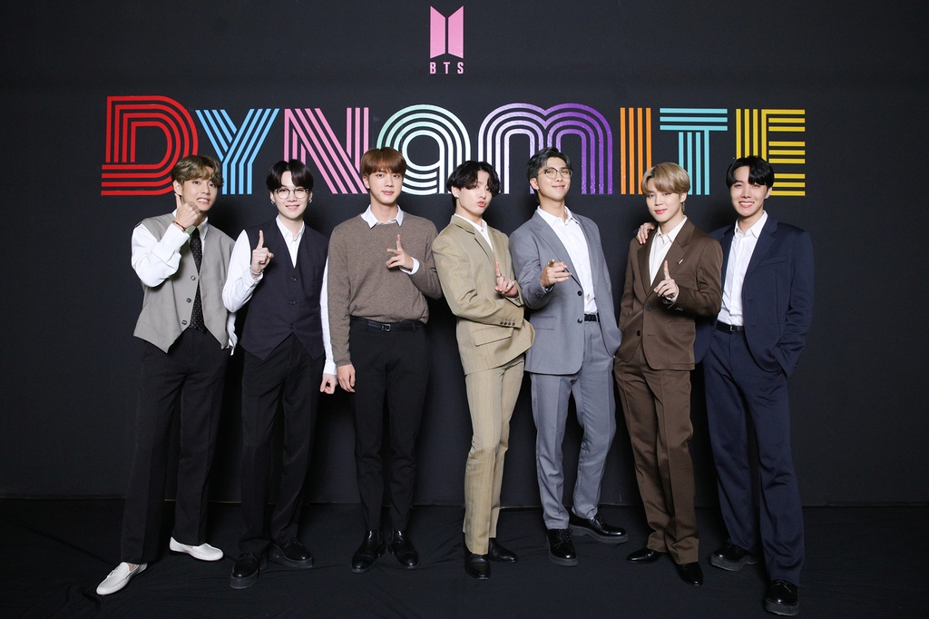 This photo, provided by Big Hit Entertainment on Sept. 2, 2020, shows members of K-pop sensation BTS posing for photos during an online press conference to celebrate the band's single "Dynamite" debuting at No. 1 on the Billboard Hot 100 chart. (PHOTO NOT FOR SALE) (Yonhap)