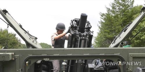 In this 2019 file photo provided by the Defense Acquisition Program Administration, a soldier tests a newly developed 120-millimeter self-propelled mortar system. (PHOTO NOT FOR SALE) (Yonhap)