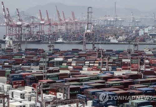 This undated file photo shows stacks of import-export cargo containers at South Korea's largest seaport in Busan, 450 kilometers southeast of Seoul. (Yonhap)