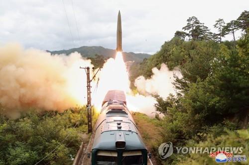 In this photo, released by North Korea's official Korean Central News Agency on Sept. 16, 2021, the North's "railway-borne missile regiment" appears to launch a short-range ballistic missile from a train during a firing drill in a central mountainous area of the North a day earlier. North Korea fired two ballistic missiles into waters off its east coast on Sept. 15, according to South Korean military authorities. Pak Jong-chon, who has been promoted to the Politburo of the Central Committee of the ruling Workers' Party of Korea, guided the latest drills, along with other top officials. (For Use Only in the Republic of Korea. No Redistribution) (Yonhap)
