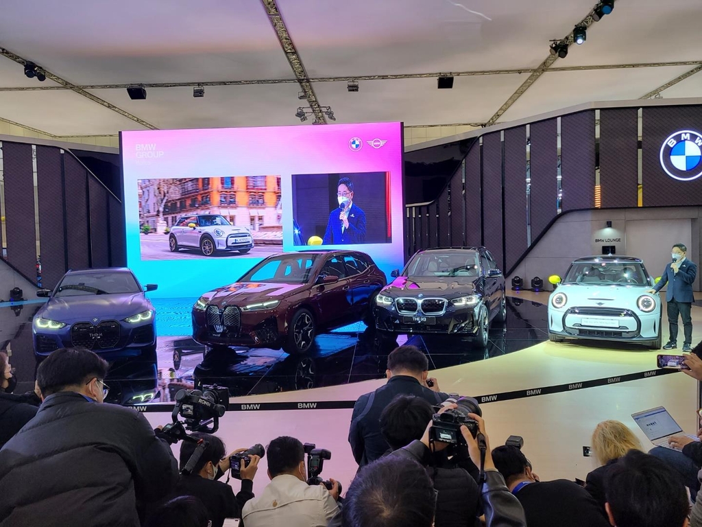 This photo taken Nov. 25, 2021, shows BMW's electric models (from left) -- the i4 Gran Coupe, the iX flagship SUV, the iX3 midsized SUV and the all-new MINI Electric -- during the Seoul Mobility Show at KINTX in Goyang, just north of Seoul. (Yonhap)