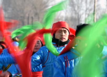 Bai's son is dancing yangko with the drum beat on Jan. 17.