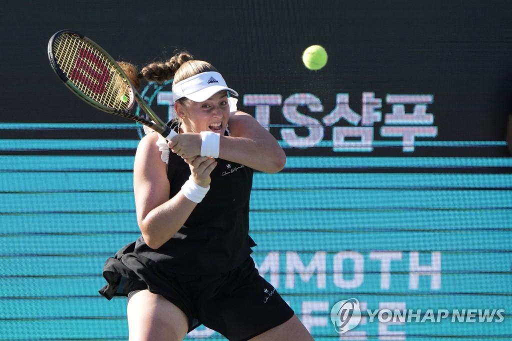 In this Associated Press photo, Jelena Ostapenko of Latvia hits a shot to Emma Raducanu of Britain during their women's singles semifinal match at the WTA Hana Bank Korea Open at Olympic Park Tennis Center in Seoul on Sept. 24, 2022. (Yonhap)