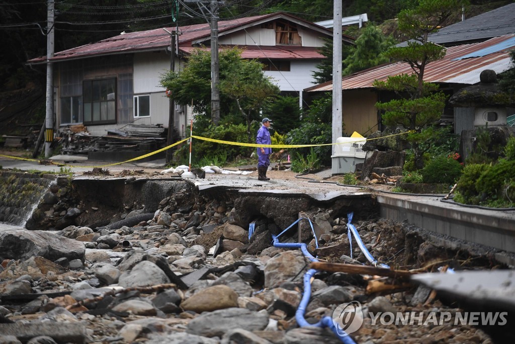 CORRECTION-JAPAN-WEATHER-RAIN-FLOOD