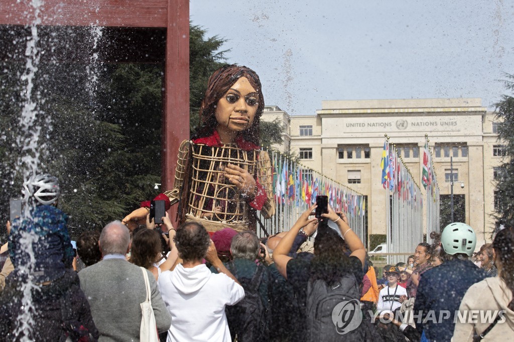 SWITZERLAND GIANT PUPPET AMAL REFUGEE