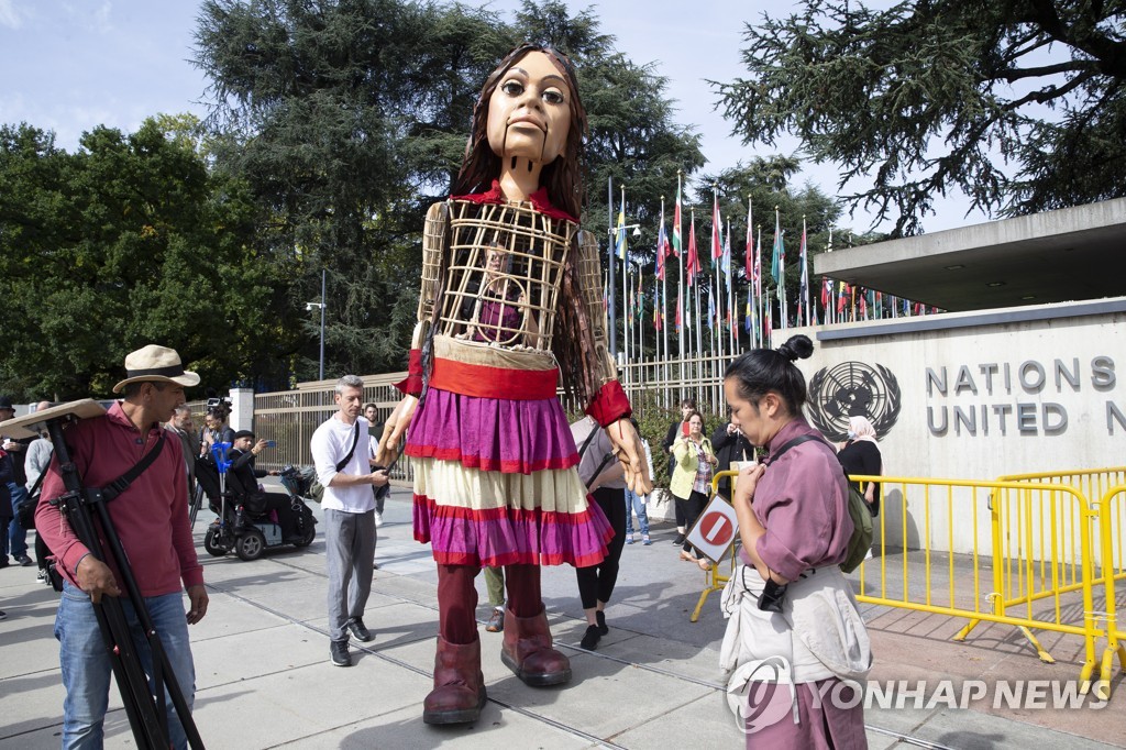 SWITZERLAND GIANT PUPPET AMAL REFUGEE