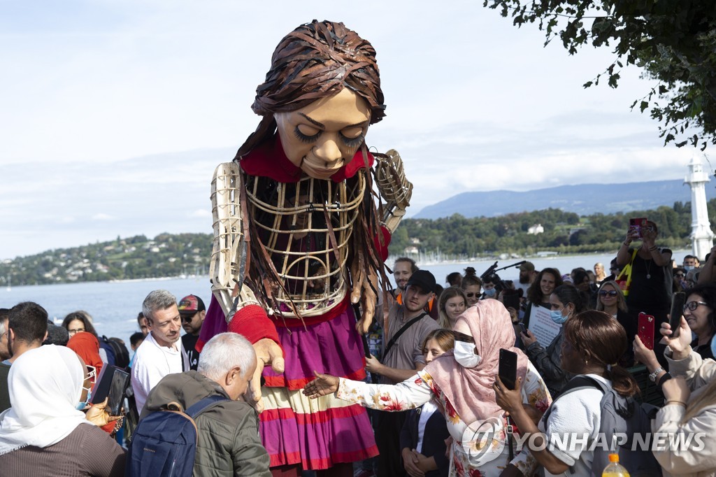 SWITZERLAND GIANT PUPPET AMAL REFUGEE