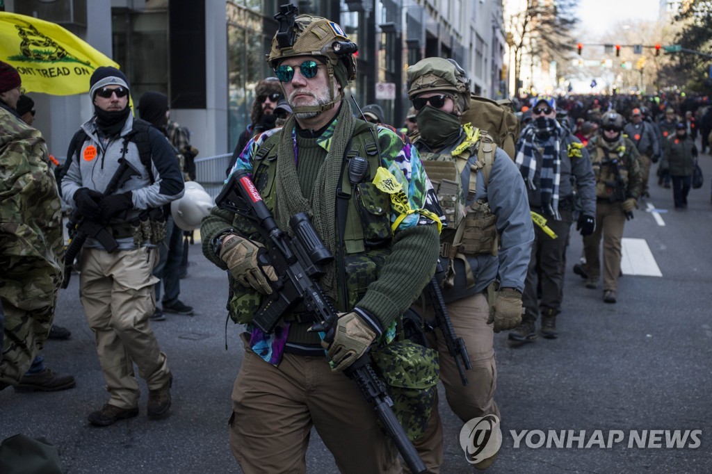 US-GUN-RIGHTS-ADVOCATES-FROM-ACROSS-U.S.-RALLY-IN-VIRGINIA'S-CAP