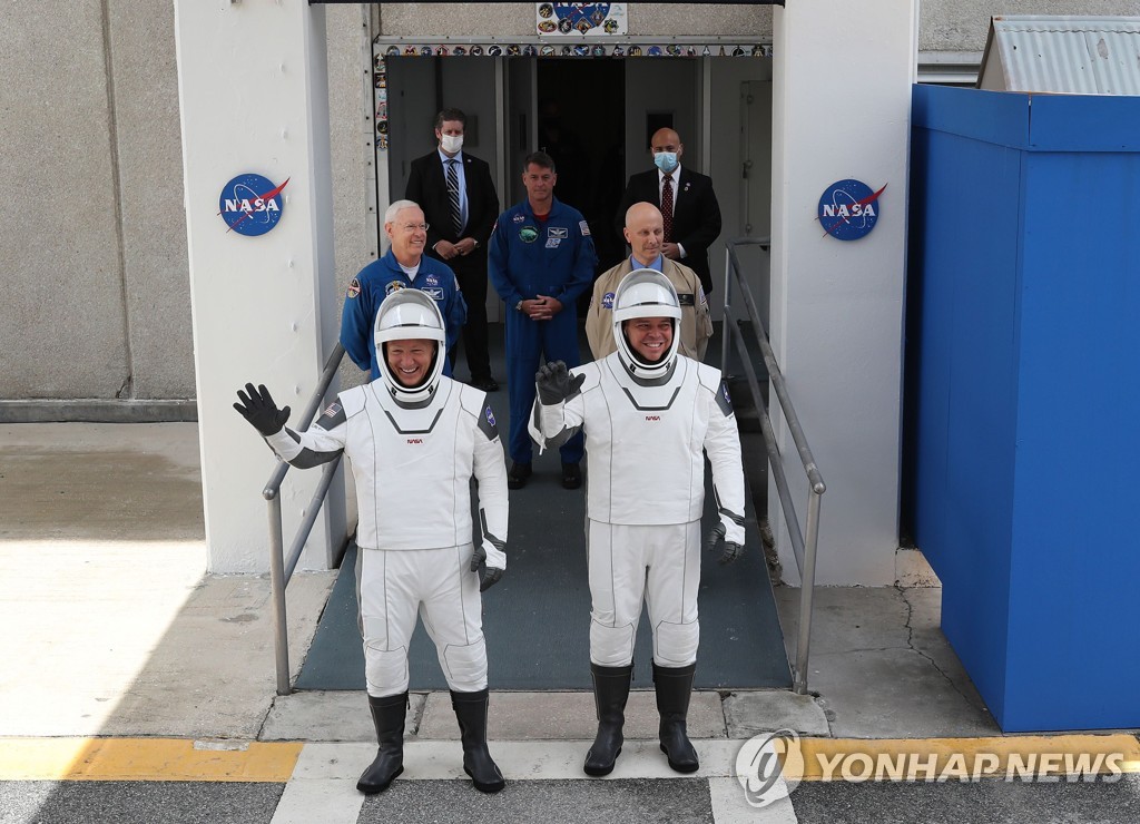 US-NASA-SCRUBS-LAUNCH-OF-THE-SPACEX-FALCON-9-ROCKET-AND-MANNED-C