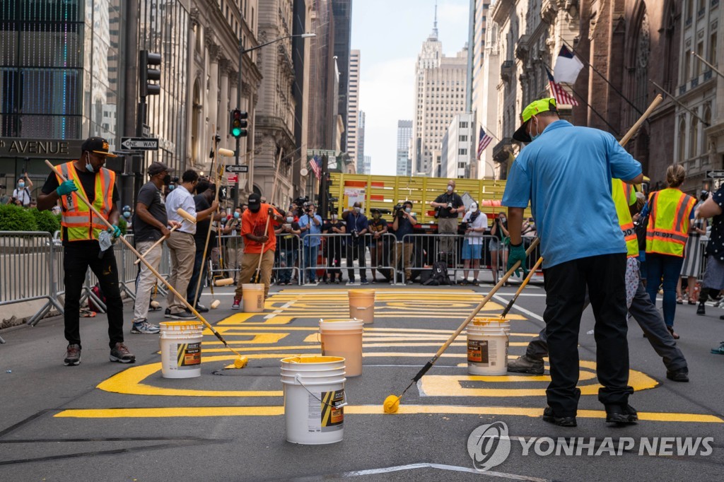 US-BLACK-LIVES-MATTER-MURAL-PAINTED-ON-STREET-IN-FRONT-OF-TRUMP-