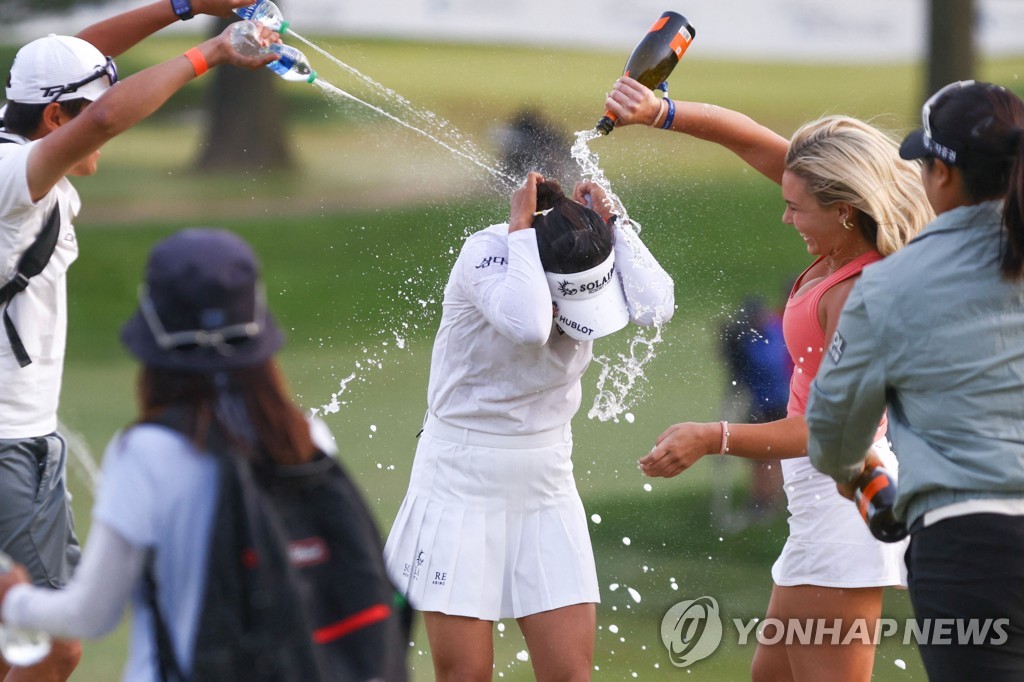 In this Getty Images photo, Ko Jin-young of South Korea (C) is doused with water and champagne after winning the Cognizant Founders Cup on the LPGA Tour at Upper Montclair Country Club in Clifton, New Jersey, on May 14, 2023. (Yonhap)