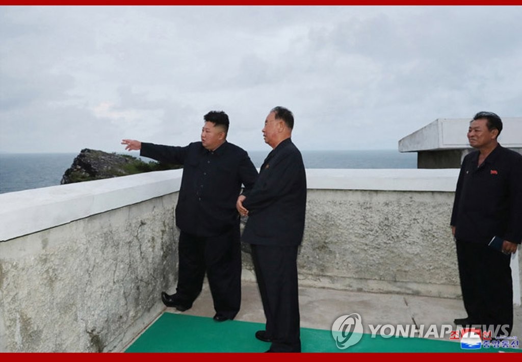 This photo released Aug. 11, 2019, by the North's Korean Central News Agency captures its leader Kim Jong-un (L) watching the test-firing of missiles that took place the previous day. (For Use Only in the Republic of Korea. No Redistribution) (Yonhap)