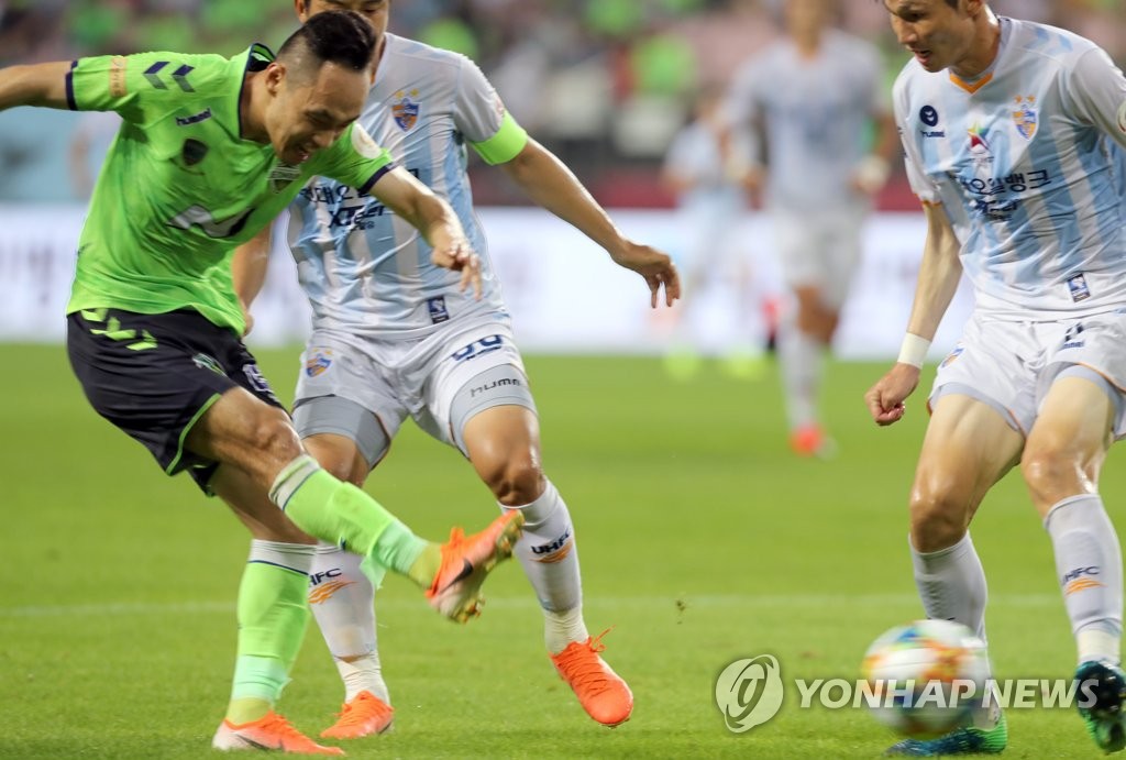 Jeonbuk forward kicks ball Jeonbuk forward kicks ball