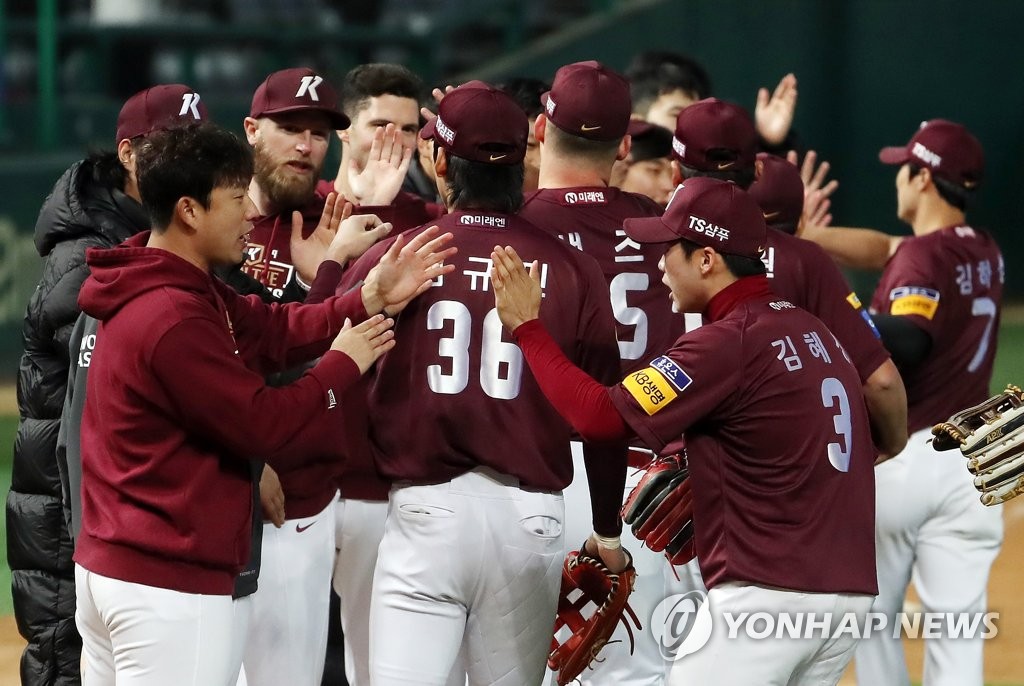 Players of the Kiwoom Heroes celebrate their 3-0 victory over the SK Wyverns in Game 1 of the second round Korea Baseball Organization (KBO) playoff series at SK Happy Dream Park in Incheon, 40 kilometers west of Seoul, on Oct. 14, 2019. (Yonhap)