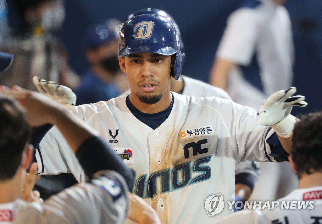 In this file photo from Aug. 29, 2020, Aaron Altherr of the NC Dinos is greeted by teammates after hitting a two-run home run against the SK Wyverns in the bottom of the seventh inning of a Korea Baseball Organization regular season game at Changwon NC Park in Changwon, 400 kilometers southeast of Seoul. (Yonhap)
