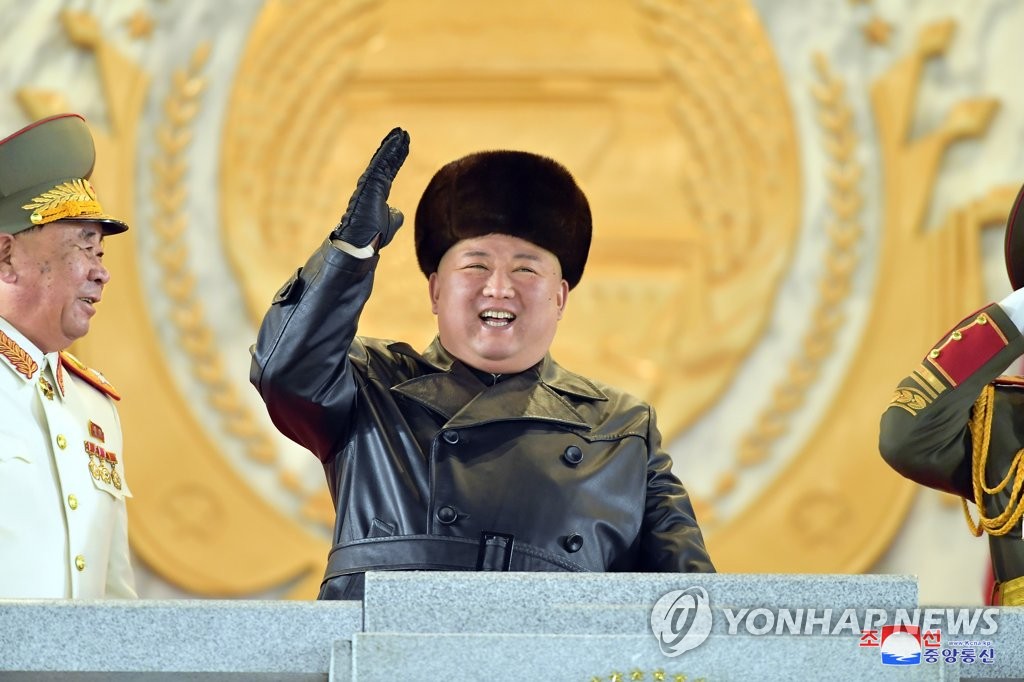 North Korean leader Kim Jong-un (C) acknowledges the crowd during a military parade at Kim Il-sung Square in Pyongyang on Jan. 14, 2021, to celebrate the recently concluded eighth congress of the North's ruling Workers' Party, in this photo released by the North's official Korean Central News Agency the next day. (For Use Only in the Republic of Korea. No Redistribution) (Yonhap)