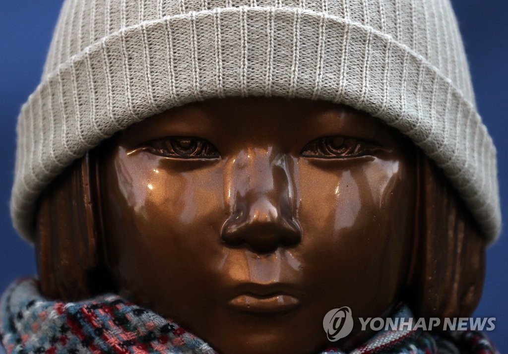 This photo, taken on Jan. 20, 2021, shows the face of a statue representing the victims of Japan's wartime sexual slavery in front of the site of the former Japanese Embassy in central Seoul. (Yonhap)