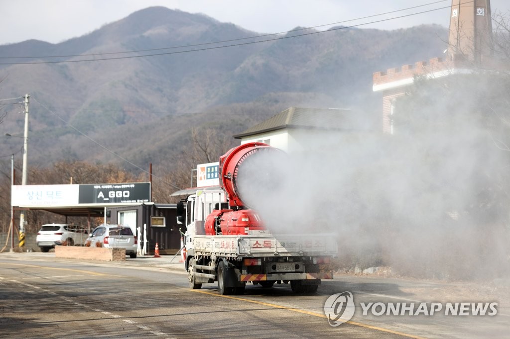 A truck applies disinfectants around a poultry farm in Icheon, south of Seoul, on Feb. 15, 2021. (Yonhap)