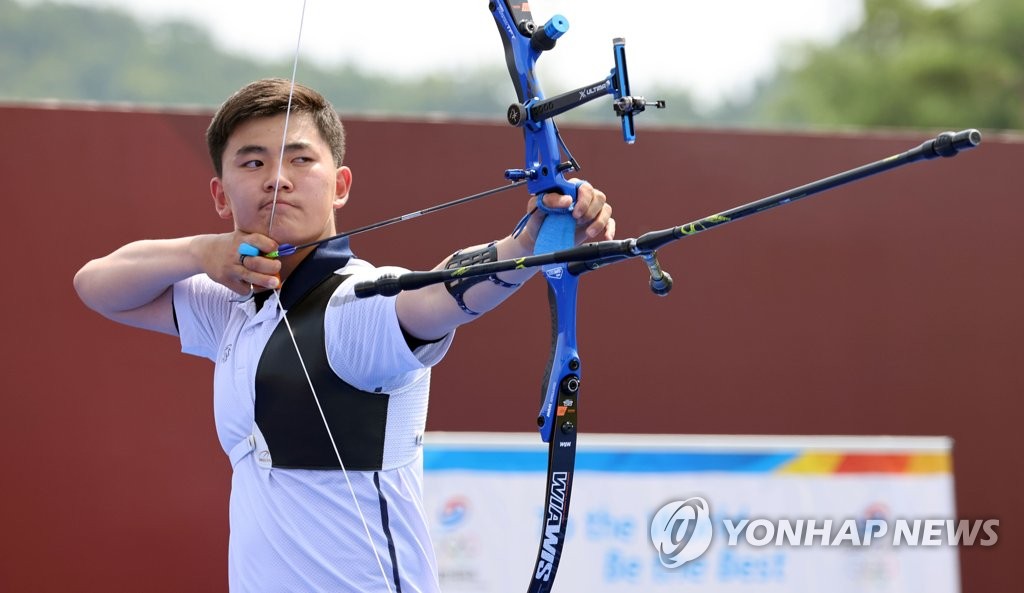 South Korean archer Kim Je-deok poses with his bow during the national team media day event at the Jincheon National Training Center in Jincheon, 90 kilometers south of Seoul, on June 28, 2021. (Yonhap)