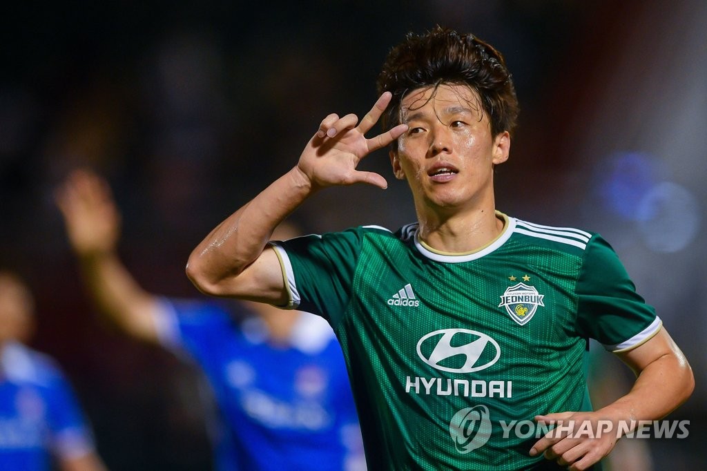 In this May 1, 2022, file photo provided by the Asian Football Confederation (AFC), Kim Bo-kyung of Jeonbuk Hyundai Motors celebrates his goal against Yokohama F. Marinos during the clubs' Group H match at the AFC Champions League at Thong Nhat Stadium in Ho Chi Minh City. (PHOTO NOT FOR SALE) (Yonhap)