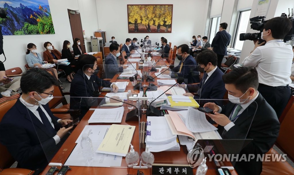 This file photo taken on May 23, 2022, shows members of the parliament subcommittee on budget and accounts attending a meeting for a review of an extra budget bill at the National Assembly in Seoul. (Pool photo) (Yonhap)