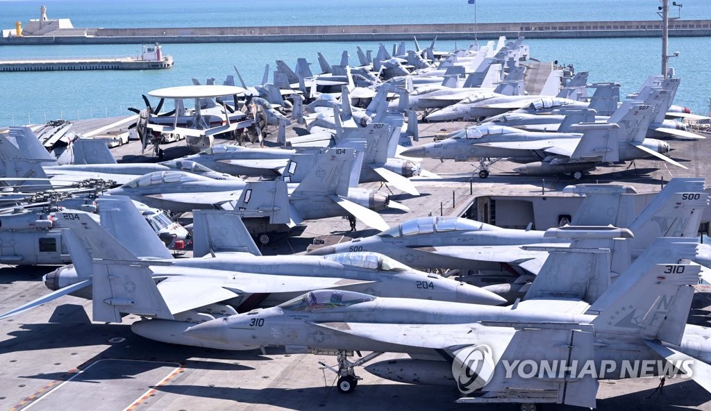 Military aircraft are seen aboard the USS Ronald Reagan aircraft carrier in South Korea's southeastern city of Busan on Sept. 23, 2022. (Pool photo) (Yonhap) 