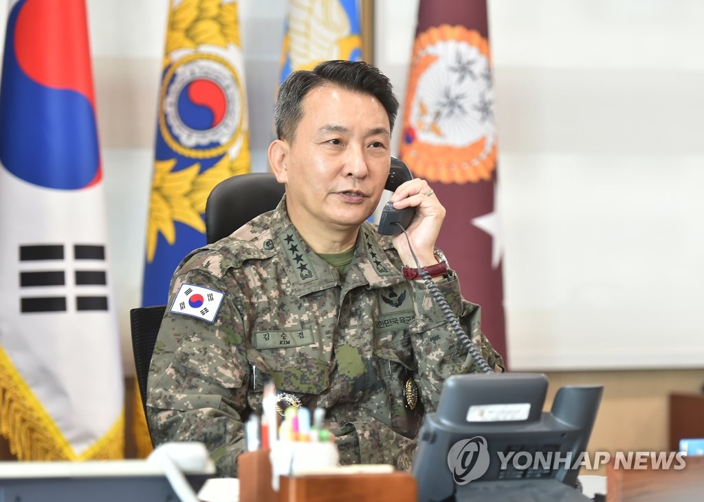 South Korea's Joint Chiefs of Staff (JCS) Chairman Gen. Kim Seung-kyum talks over the phone with his U.S. counterpart, Gen. Mark Milley, in Seoul on Oct. 5, 2022, one day after North Korea's intermediate-range ballistic missile launch into the Pacific the previous day. The JCS provided this photo. (PHOTO NOT FOR SALE) (Yonhap)