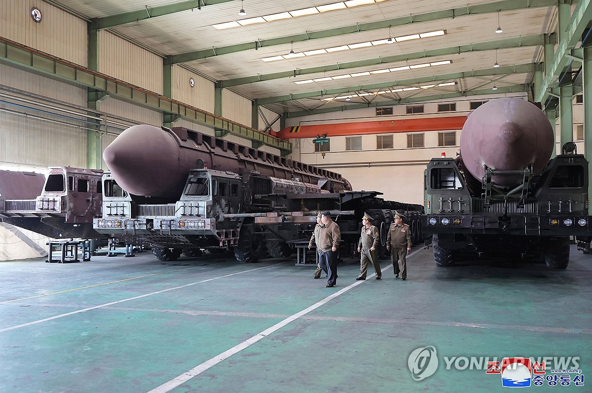 This photo, carried by North Korea's official Korean Central News Agency on May 18, 2024, shows the North's leader Kim Jong-un (C) inspecting a defense industrial complex the previous day. (For Use Only in the Republic of Korea. No Redistribution) (Yonhap)