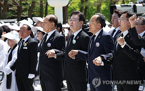 Rival party leaders hold hands