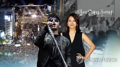 This undated image taken from Yonhap News TV shows singer Lee Seung-hwan (L) and Lee Hyo-ri. Together with other artists, the two released a song consoling the public over the latest influence-peddling scandal centered on President Park Geun-hye and her friend in November 2016. (Yonhap) 