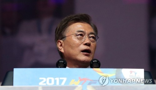 This file photo, taken on June 24, 2017, shows President Moon Jae-in speaking during the opening ceremony of the World Taekwondo Federation (WTF) World Taekwondo Championships at T1 Arena in Taekwondowon in Muju, North Jeolla Province, 240 kilometers south of Seoul. (Yonhap)