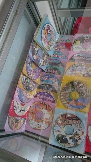 This photo, made available by Radio Free Asia on July 9, 2017, shows DVDs of American-made animated films that are offered at a stall in Pyongyang. (Yonhap)