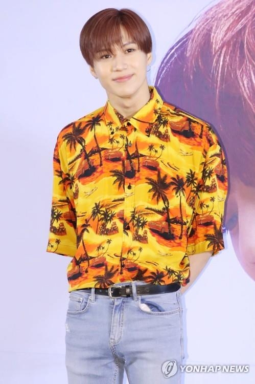 SHINee member Taemin poses for photos during a press conference on June 11, 2018. (Yonhap)