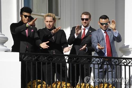 This AP photo shows Washington Nationals players dancing to a rendition of "Baby Shark" during a ceremony held at the White House in Washington on Nov. 4, 2019. (Yonhap)