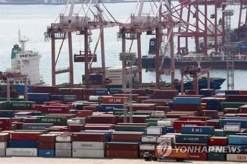 This undated file photo shows containers carrying export goods in the southeastern port city of Busan. (Yonhap)