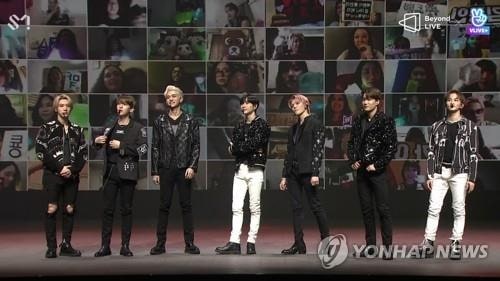 The screen capture shows members of K-pop group SuperM on stage on April 26, 2020, during the band's online concert put on by Beyond Live. (PHOTO NOT FOR SALE) (Yonhap)