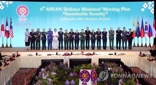 In this file photo taken Nov. 18, 2019, defense ministers of major countries hold hands during the 6th Association of Southeast Asian Nations (ASEAN) Defense Ministers' Meeting-Plus (ADMM-Plus) in Bangkok, Thailand. (Yonhap)