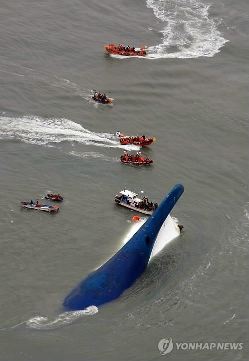 Rescue operation is under way around the capsized ferry Sewol in waters off Jindo Island in the southwestern province of South Jeolla on April 16, 2014, in this photo provided by South Jeolla provincial government. (PHOTO NOT FOR SALE) (Yonhap) 