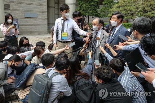 Representatives of South Korean wartime forced laborers speak to reporters at the Seoul Central District Court on June 7, 2021, after the court rejected their damages suit against Japanese companies. (Yonhap)
