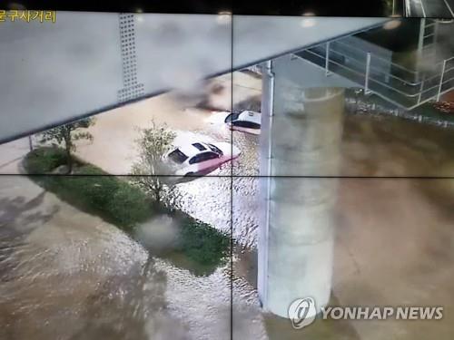 Cars remain inundated in Busan on Aug. 24, 2021, in this photo provided by the Busan Police Agency. (PHOTO NOT FOR SALE) (Yonhap)