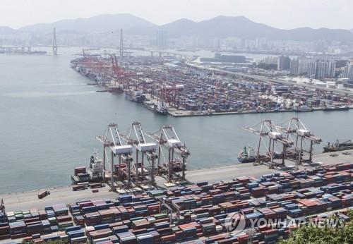 This file photo taken on July 1, 2021, shows containers being stacked up at a pier in the southeastern city of Busan. (Yonhap)