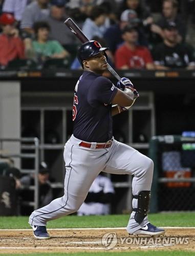 In this Getty Images file photo from Sept 24, 2019, Yasiel Puig of the Cleveland Indians hits a double against the Chicago White Sox in the top of the fourth inning of a Major League Baseball regular season game at Guaranteed Rate Field in Chicago. (Yonhap)