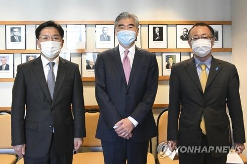 The top nuclear envoys of South Korea, the United States and Japan pose prior to their talks in Washington on Oct. 20, 2021, in this file photo provided by Seoul's foreign ministry. From left are Noh Kyu-duk (South Korea), Sung Kim (U.S.) and Takehiro Funakoshi (Japan). (PHOTO NOT FOR SALE) (Yonhap)