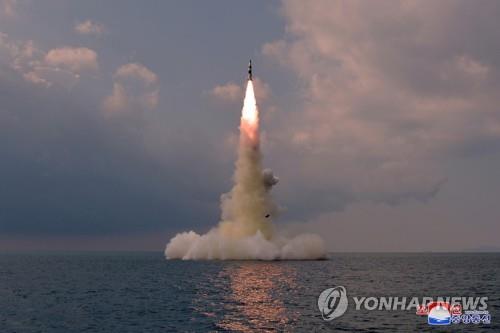 In this photo released Oct. 20, 2021, by North Korea's official Korean Central News Agency, a new type of a submarine-launched ballistic missile (SLBM) is test-fired from waters the previous day. The South Korean military said on Oct. 19 that North Korea fired what appears to be an SLBM toward the East Sea from waters east of Sinpo, a city on the North's east coast. (For Use Only in the Republic of Korea. No Redistribution) (Yonhap)